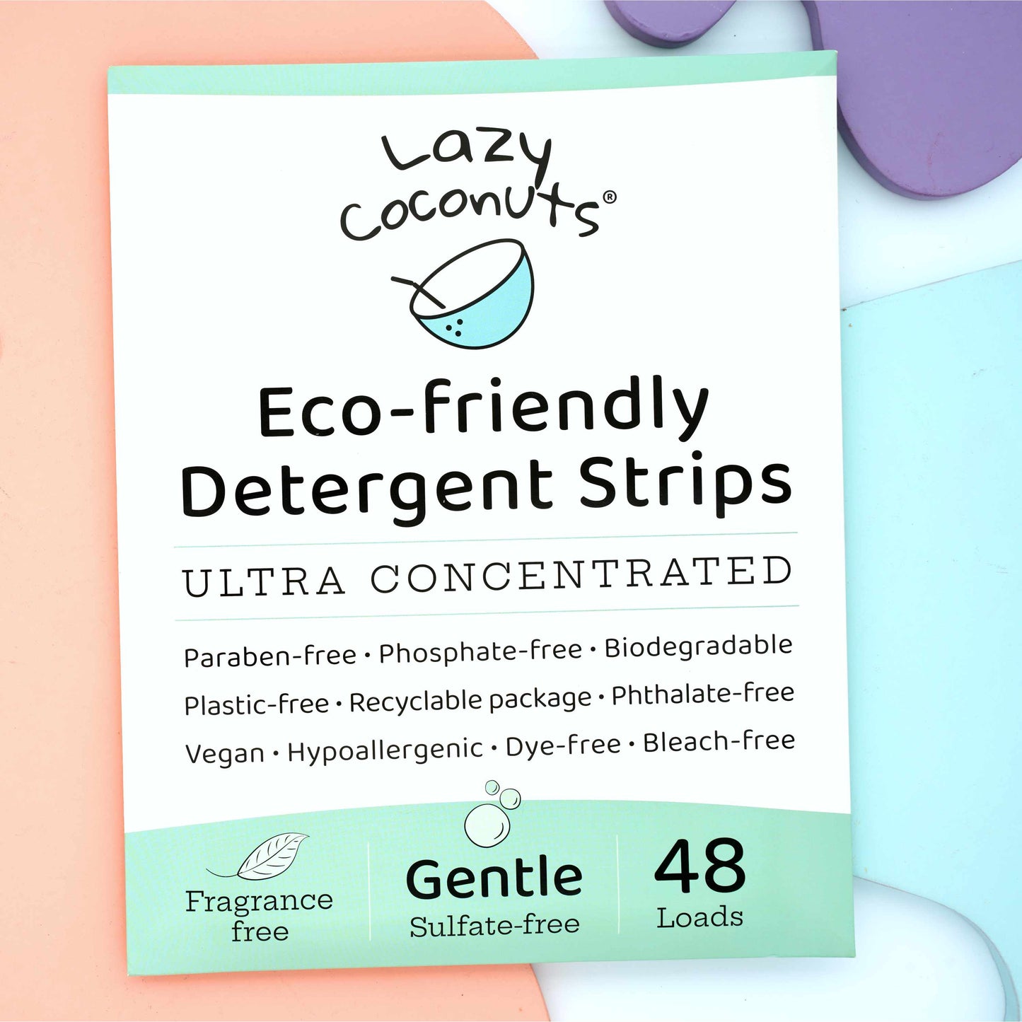 Lazy Coconuts Gentle Eco-friendly Detergent Strips packaging, showing a white and mint green box with text details and a 48 count, styled on pastel-colored background blocks.